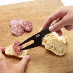 Kuhn Rikon Colori+ 3-Piece Cheese Knife Set -Peuget Knives Shop KR26682 Kuhn Rikon Cheese Knife Set in Use