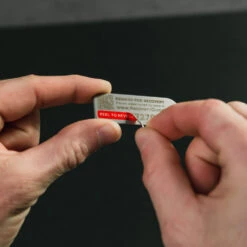 KeySmart RecoverID Anonymous Lost And Found Tag -Peuget Knives Shop KS701SS KeySmart RecoverID Tag Revealing ID Code