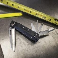 Leatherman FREE K4 Multipurpose Knife -Peuget Knives Shop LT832664 Leatherman Free K4 on Workbench