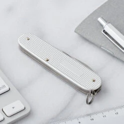 Victorinox Cadet Swiss Army Knife 8 Victorinox Cadet Swiss Army Knife -Peuget Knives Shop SA0260126 Cadet Silver Closed Back Panel Lifestyle