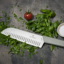 Swiss Modern Colors 7.5" Granton Edge Santoku Knife In Olive Green By Victorinox -Peuget Knives Shop VF6905617K6 Swiss Modern Santoku Close up