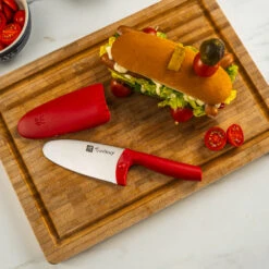 Twinny Kid's Chef's Knife By Zwilling -Peuget Knives Shop ZHTwinny Red on Sandwich Board