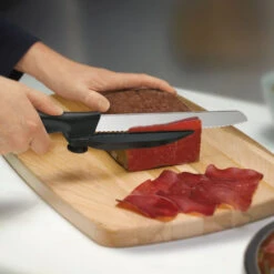 Swiss Classic 8" Serrated DUX-Knife With Adjustable Slicing Guide By Victorinox -Peuget Knives Shop vf6866321 thinslices x1000 f5168284 3453 4254 8e48 9d264357fcf8