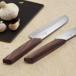 Swiss Modern 7.5" Granton Edge Santoku Knife By Victorinox -Peuget Knives Shop vf6905017kg withgarlic